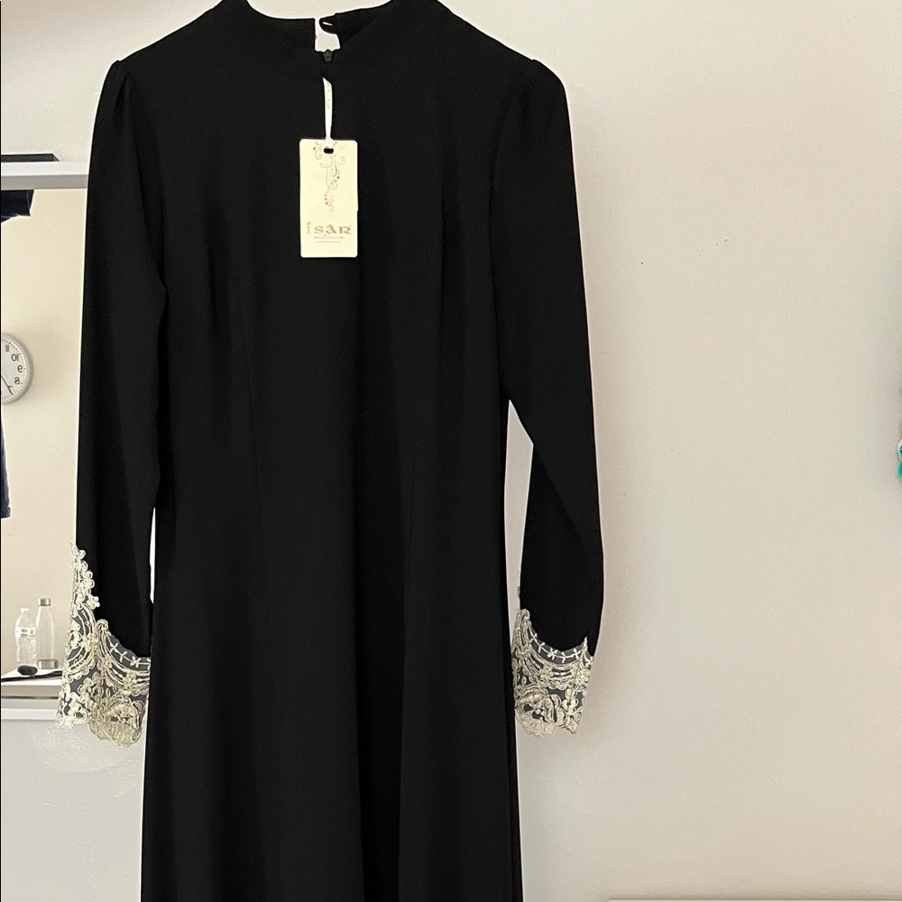 Black long dress with lace detail on sleeves and at the ends of the dress.